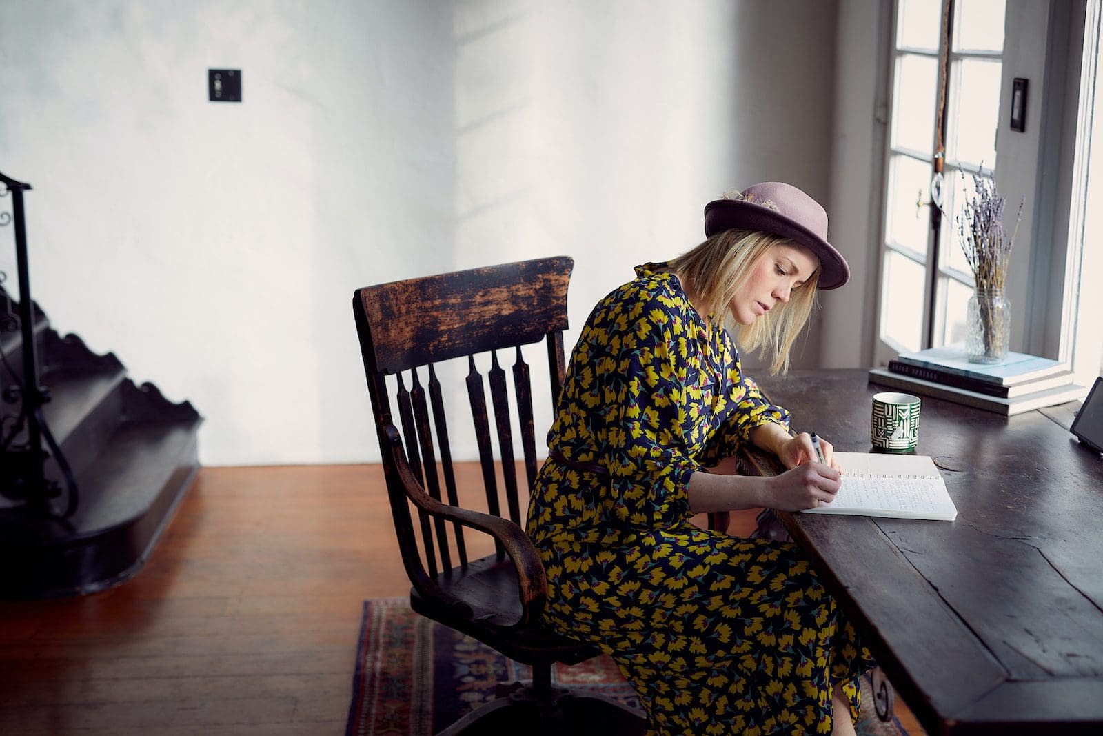 Choosing A Publisher For Your Book 2 woman in yellow and black floral dress sitting on brown wooden chair