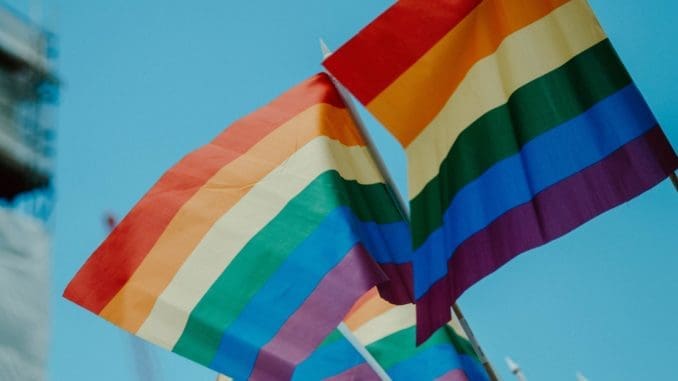 Photo by daniel james multicolored flag