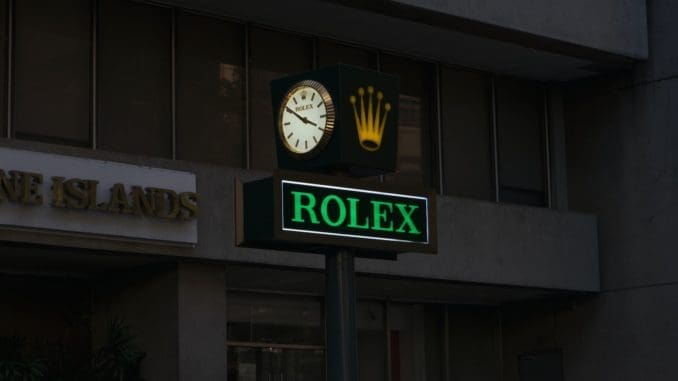 green and white UNKs coffee store signage Rolex Watches