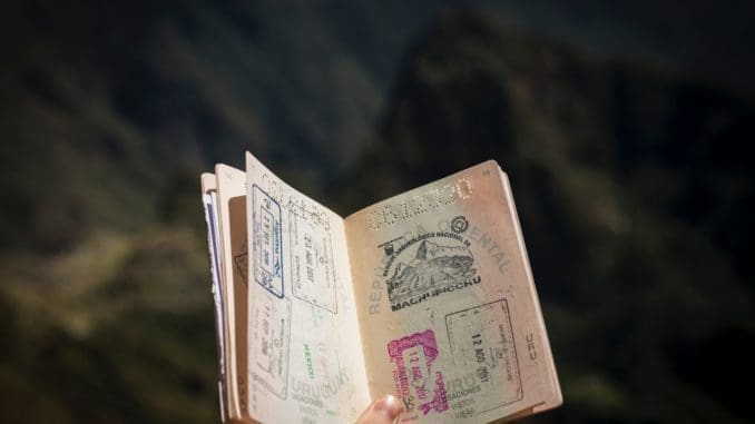 Why It Is Important To Seek Expert Guidance With A Statement Of Consent For Passport 1 person holding passport Statement of Consent