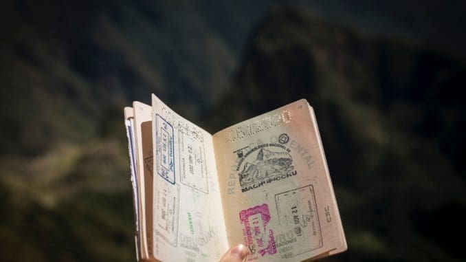 person holding passport Statement of Consent