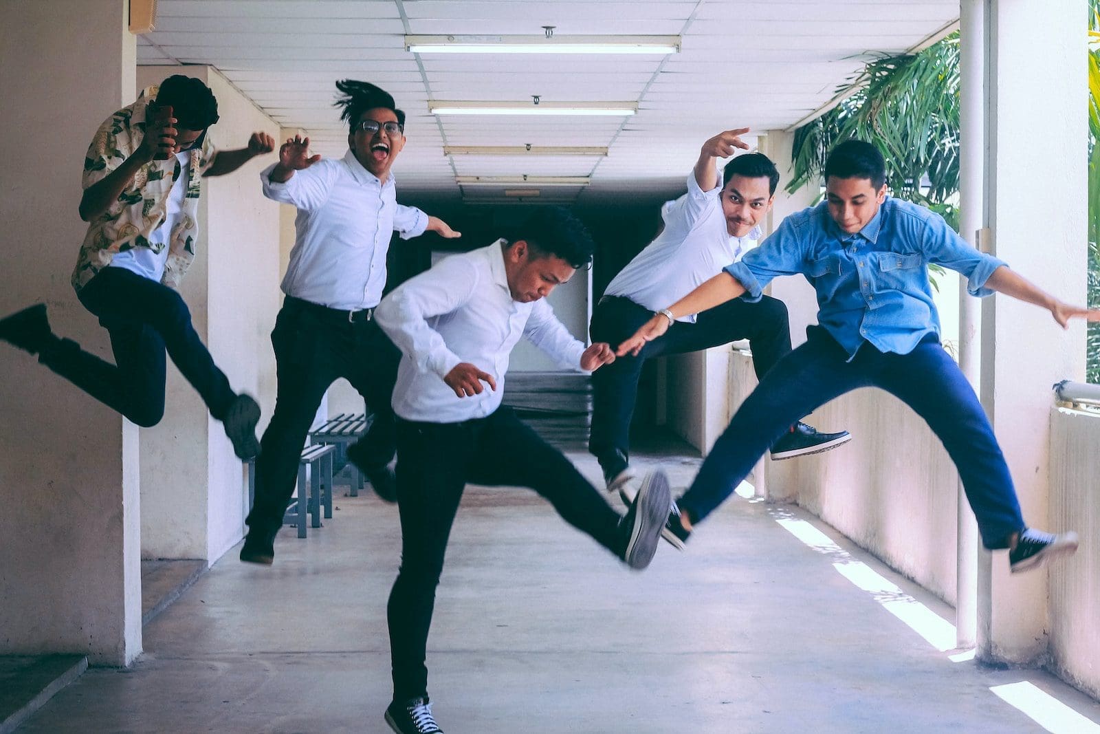 In-House Versus Outsourced Hr: Comparison Of Costs, Compliance 2 group of people doing jump shot photography