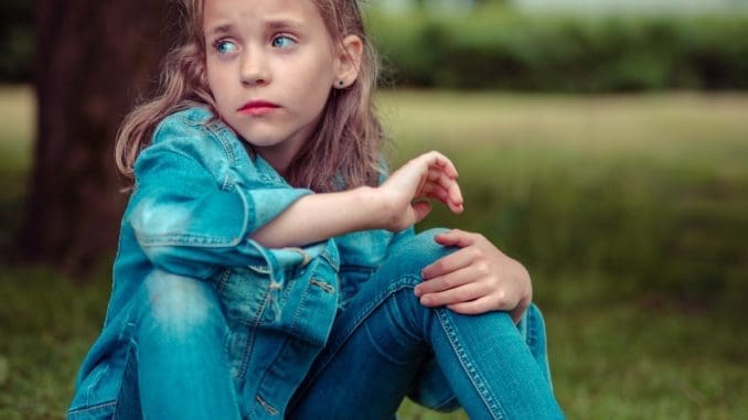 Photo by 🇸🇮 Janko Ferlič selective focus photography of girl sitting near tree teenage suicide
