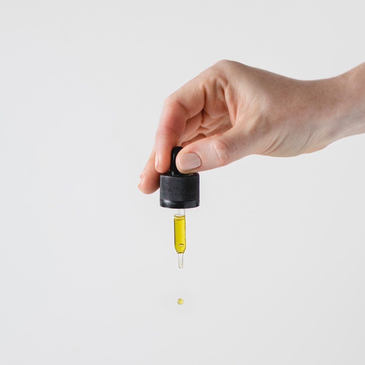 Cbd Oils In Britain. Are They Any Good? 1 person holding black and yellow hand tool