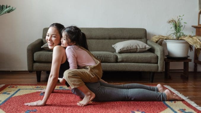 Photo of Girl Hugging Her Mom While Doing Yoga Pose your training