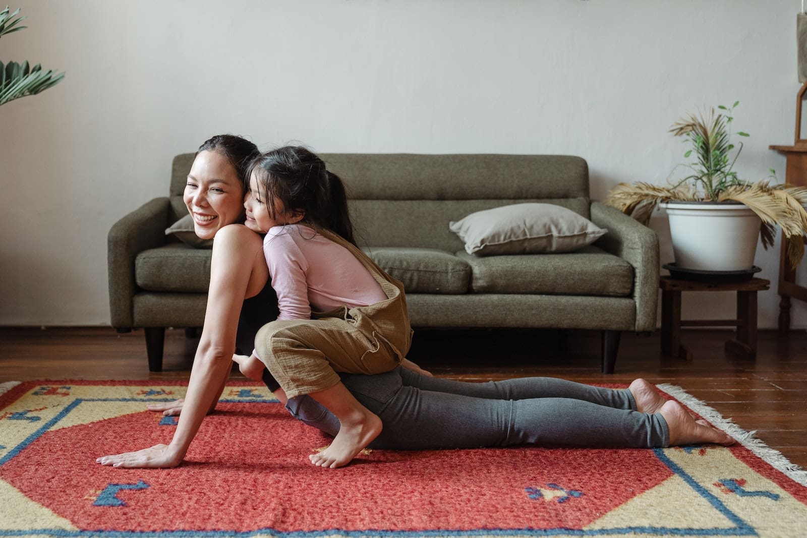 Photo of Girl Hugging Her Mom While Doing Yoga Pose your training