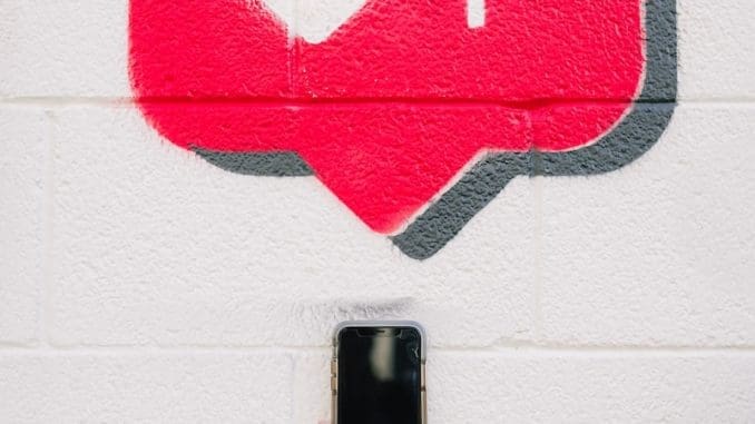 Photo by Karsten Winegeart red and white love wall decor Purchase Instagram Impressions