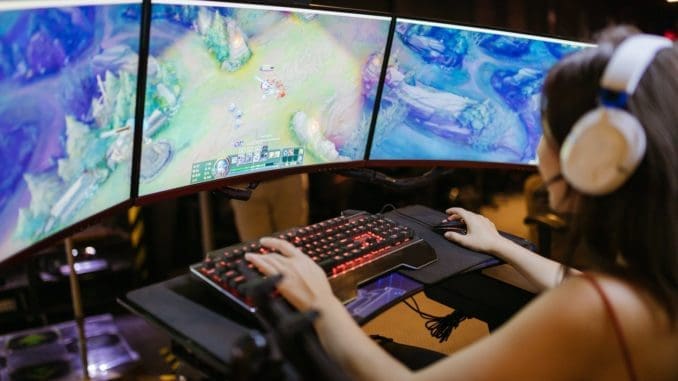 A Woman Playing League of Legends This article will explore some of the most popular Singapore slot games online.