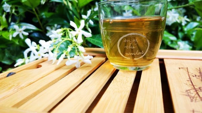 clear drinking glass green tea