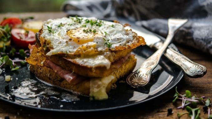 sunny side-up egg and bread on plate Eat Fat