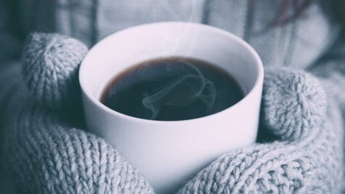 person holding white ceramic mug This winter