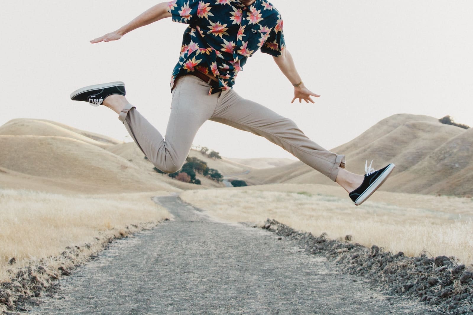 man in black shirt and gray men's pants jumping