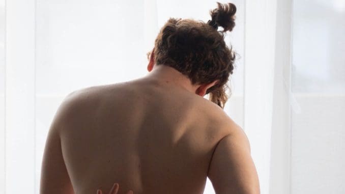 Photo by Adrian "Rosco" Stef topless woman standing near window trigger point