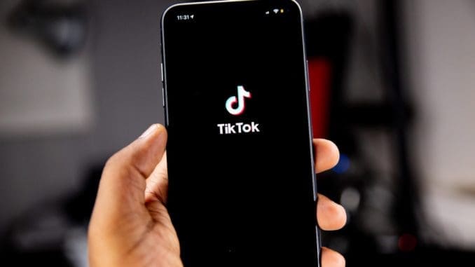 person holding black iphone 5 TikTok Follow