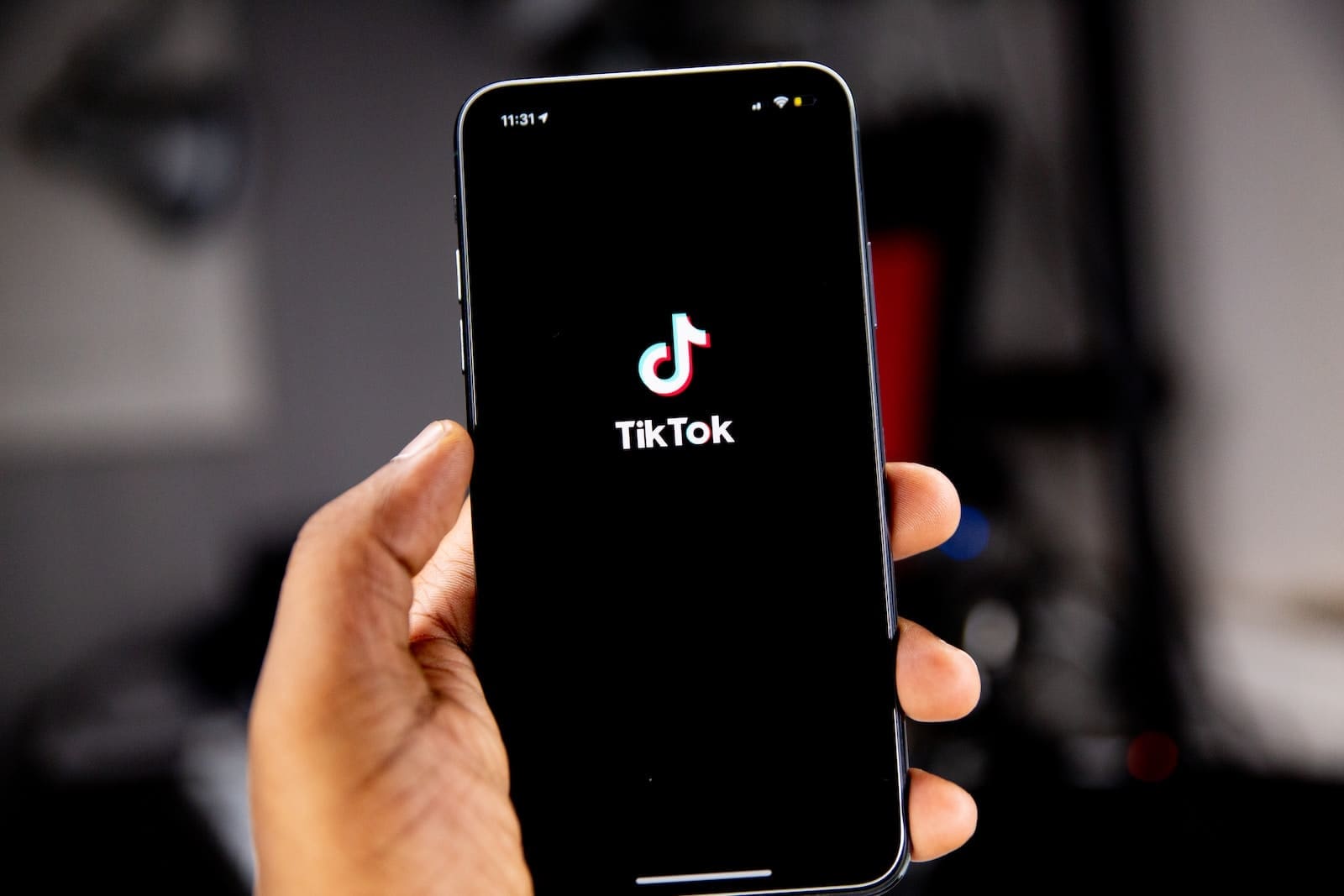 person holding black iphone 5 TikTok Follow
