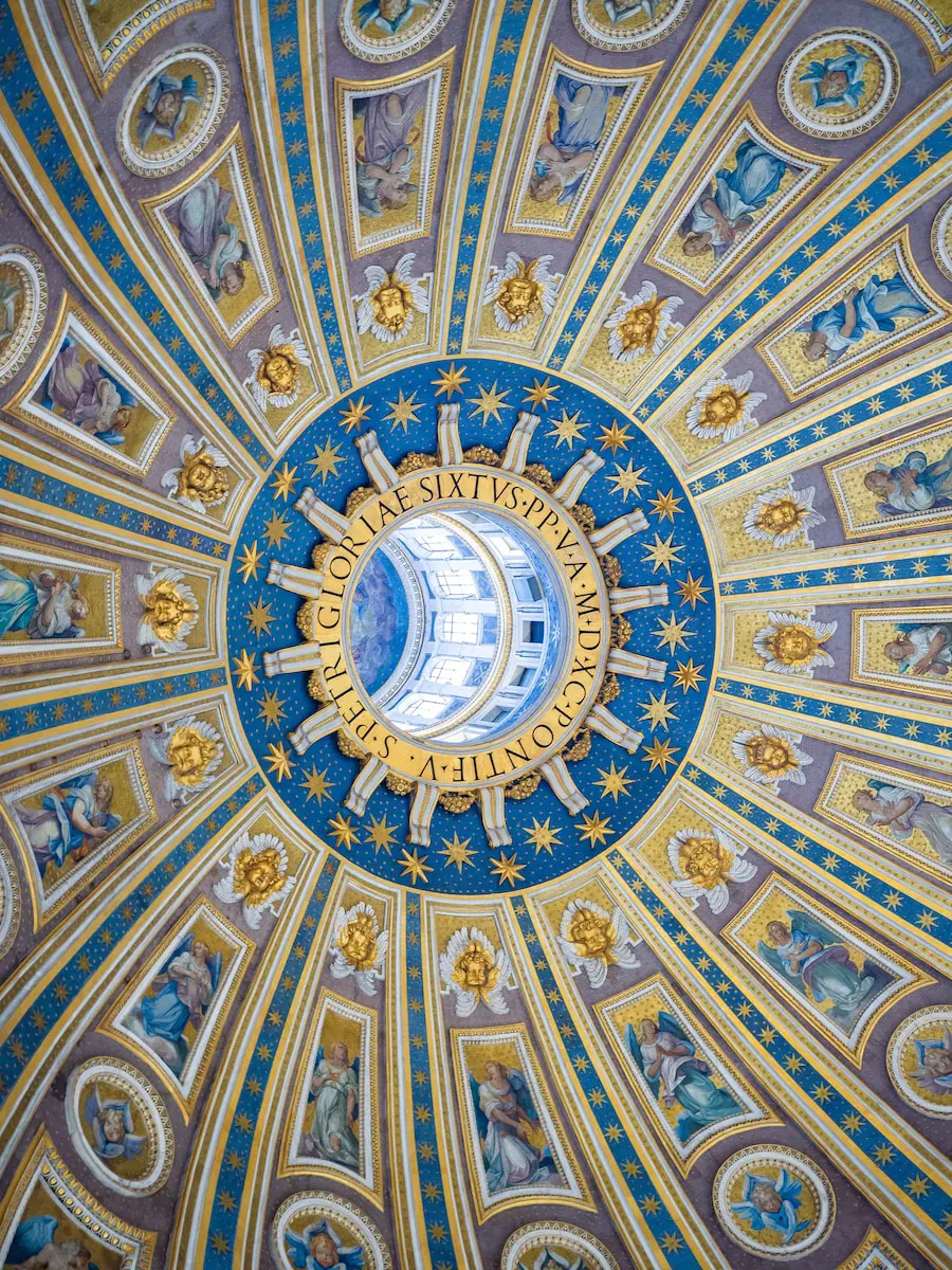 the ceiling of the dome of a building St Peter’s Basilica