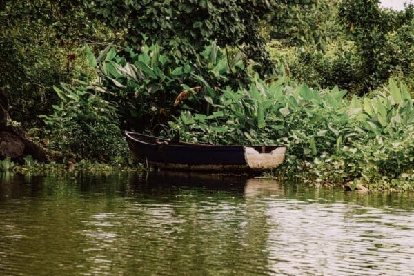 a small boat floating on top of a body of water