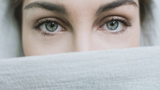 woman covered with white textile