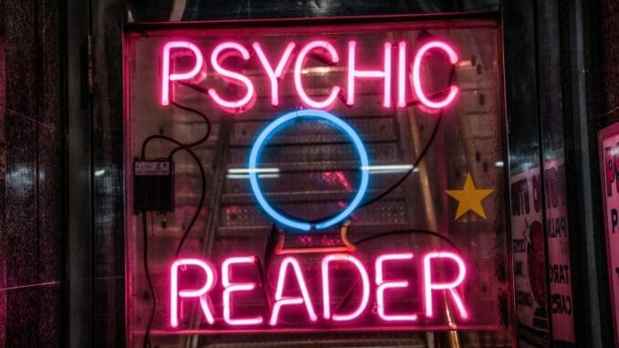 turned on red Psychic Reader neon sign psychic reading