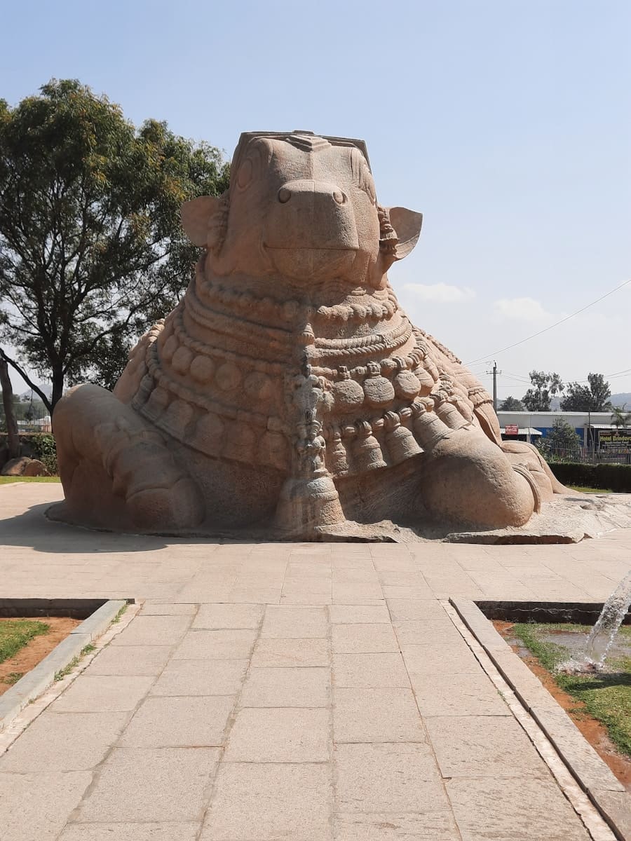 A large sand sculpture of Nandi on a walkway