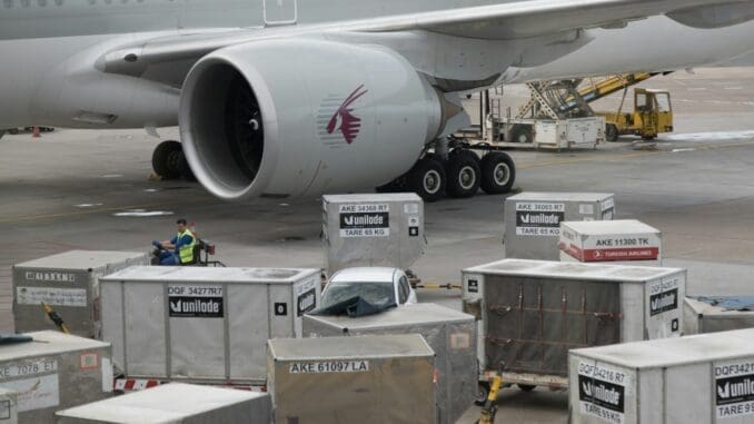 a large airplane is being loaded with luggage . Timing and logistics