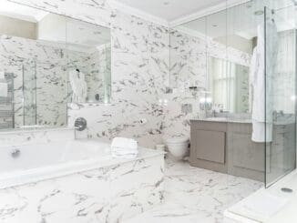 Luxurious marble bathroom with bathtub and vanity. bathroom-remodel-ideas-that-add-the-most-value