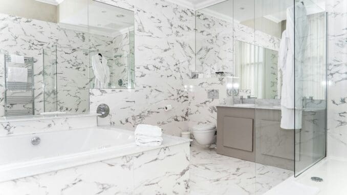 Luxurious marble bathroom with bathtub and vanity. bathroom-remodel-ideas-that-add-the-most-value