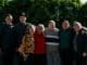 family ties group of people standing near green trees during daytime